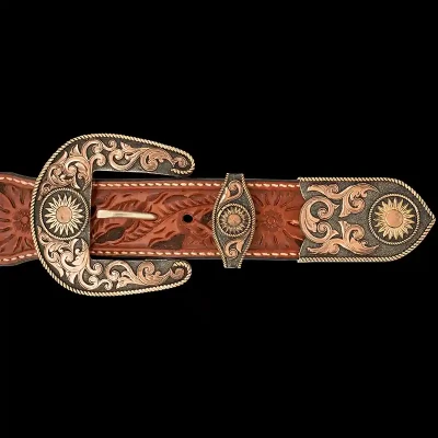 A custom western three piece belt buckle set featuring a bronze and copper scrollwork and sunflowers 